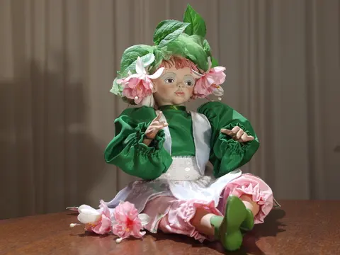A one-of-a-kind artist-made fantasy doll styled as a fuchsia-flower fairy, with a hand-painted face