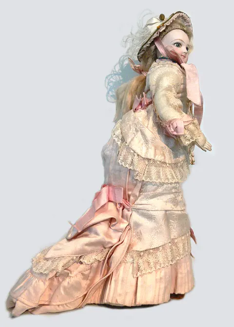 An antique French bisque fashion doll in a promenade dress, attributed to Émile Jumeau
