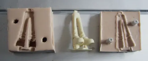 A cast resin figure freshly removed from its silicone mould