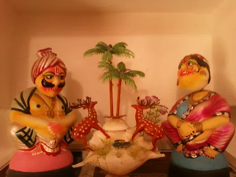 Painted wooden Kondapalli toy figures displayed at a workshop